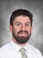 John Paul Loggia is wearing a white business shirt and tie.